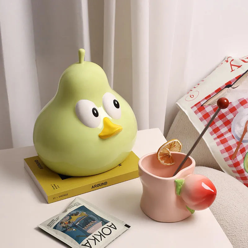 White porcelain ceramic tissue box with pear shape and animal-themed decorative design