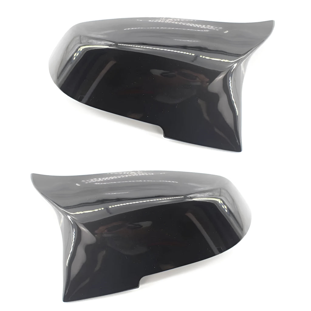 Pair of paint bright black BMW F-Series rear-view mirror replacement shells.