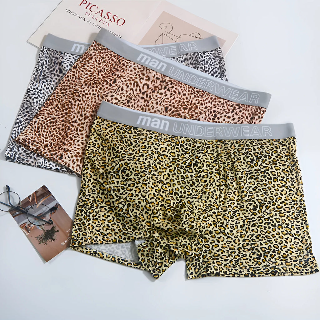 Men's loose fit leopard print underwear in grey and yellow, showing mid-waist design and soft fabric texture.