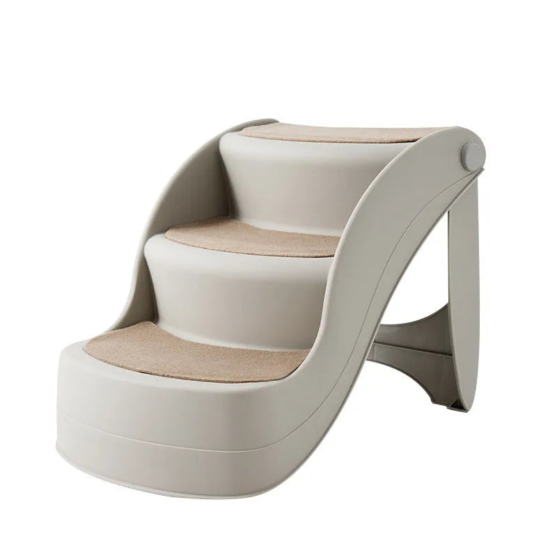 Foldable plastic step ladder for small pets on a home floor next to a sofa.
