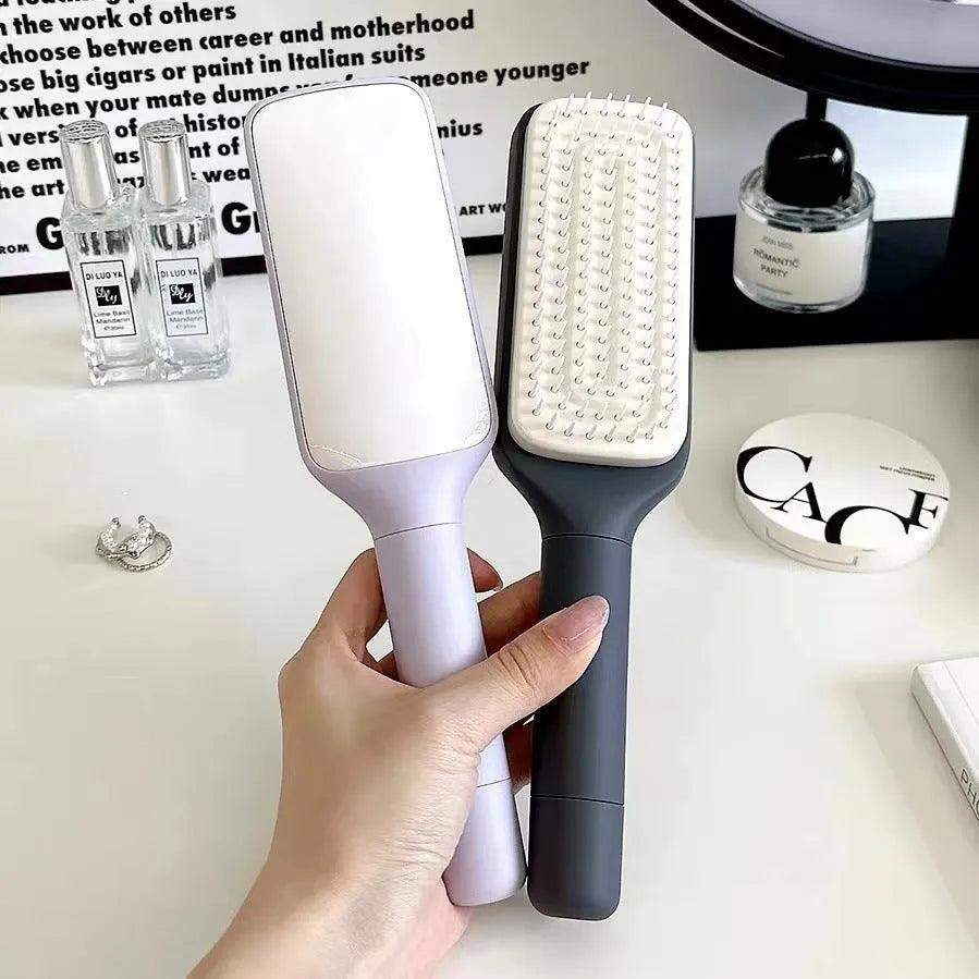 Roland purple self-cleaning hairbrush with rotating handle and anti-static massage teeth