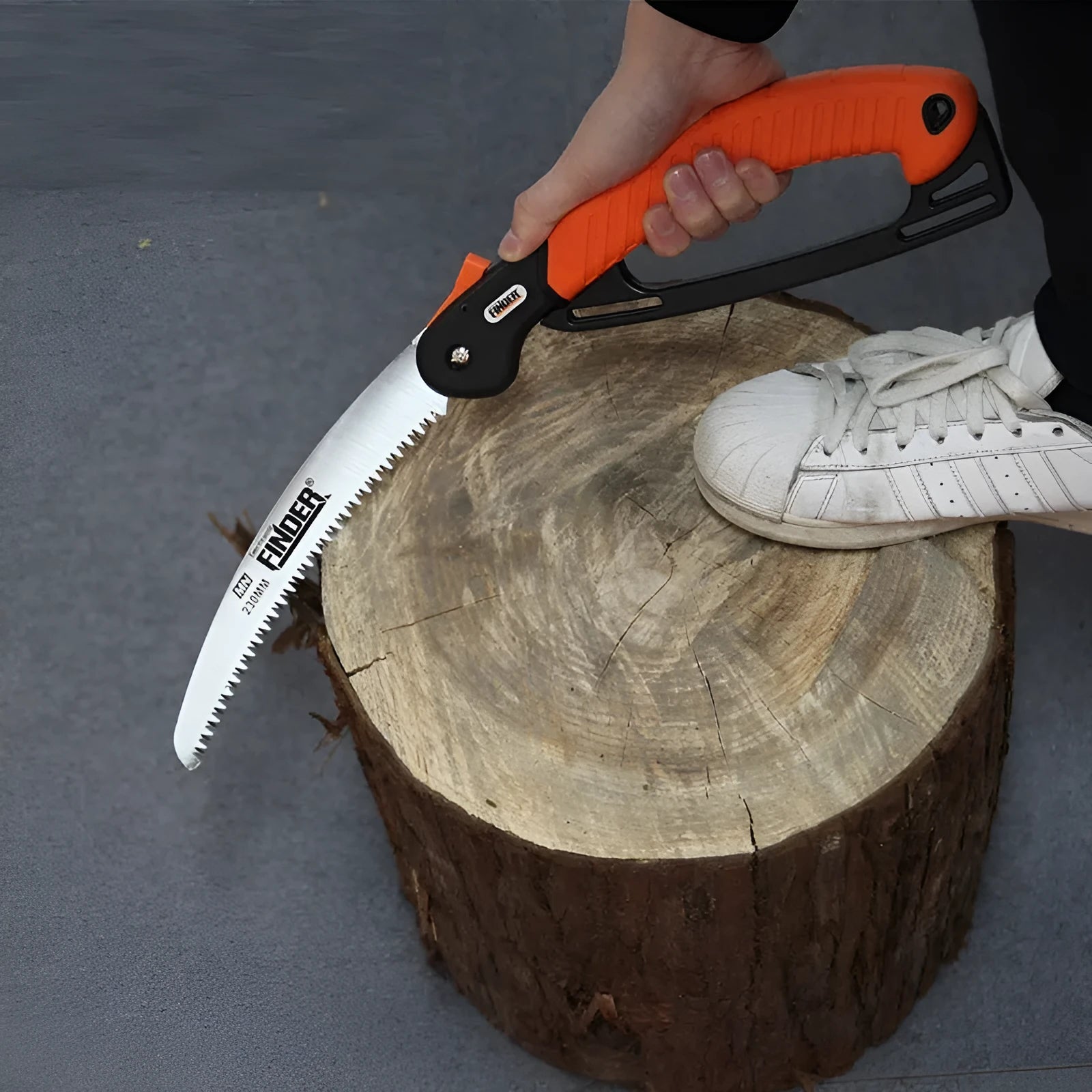 Folding garden trunk saw with 230mm steel blade and TPR grip handle in folded position