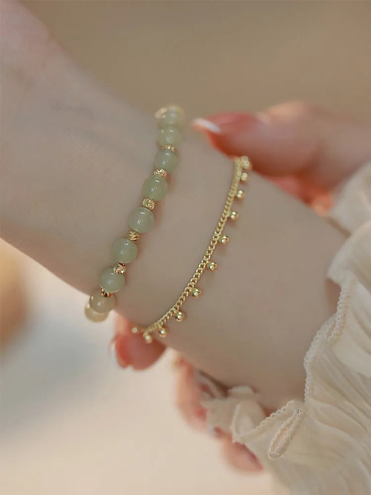 Hetian Jade bracelet with princess running beaded style on neutral background