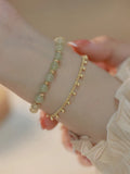 Hetian Jade bracelet with princess running beaded style on neutral background