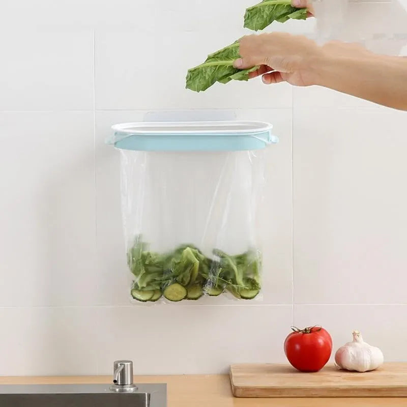 Blue plastic kitchen rubbish bag storage rack with open bench t frame design on a worktop.