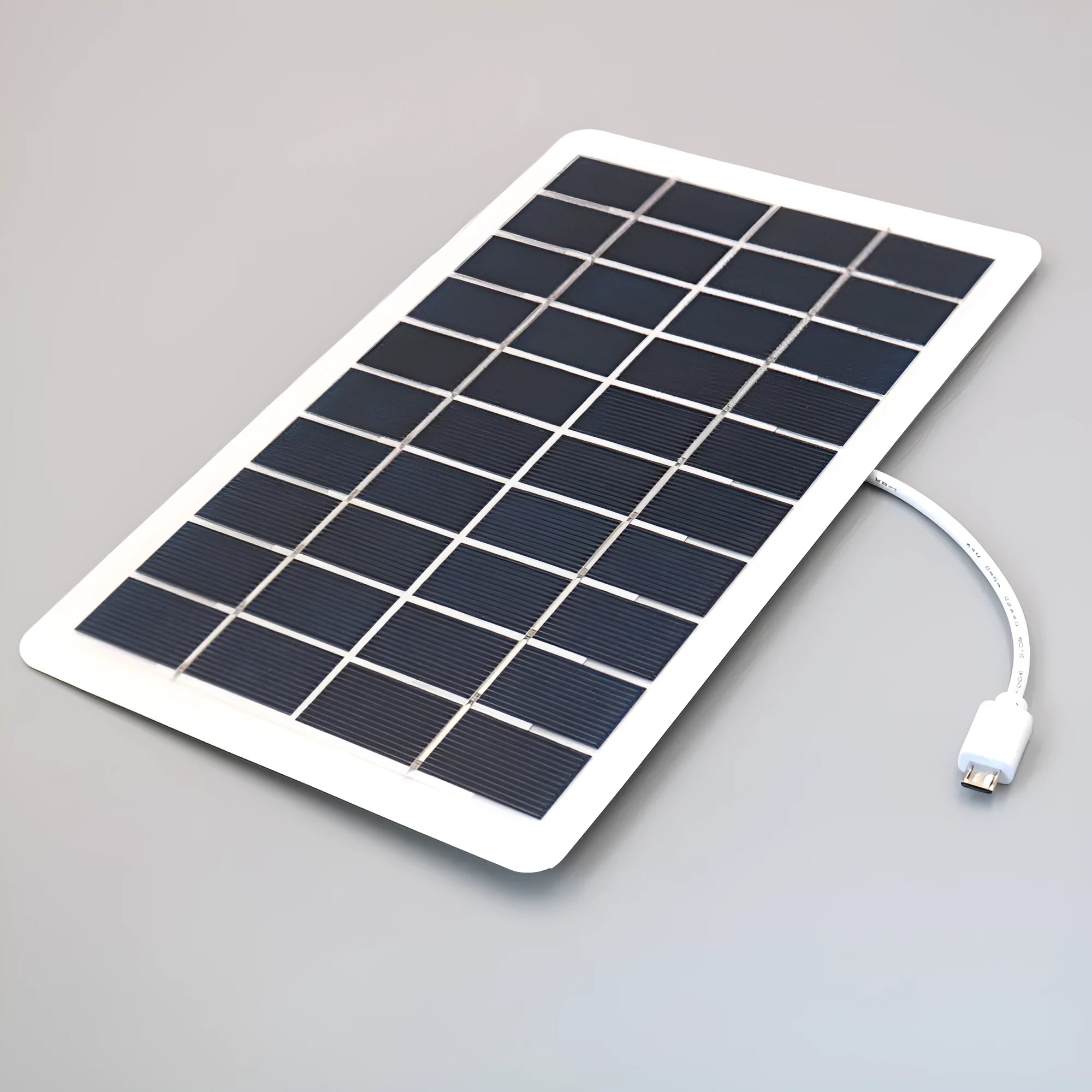 Black portable solar panel charger with USB output for mobile phones