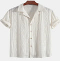 Men's loose fit short sleeve cardigan in solid colour on a hanger.