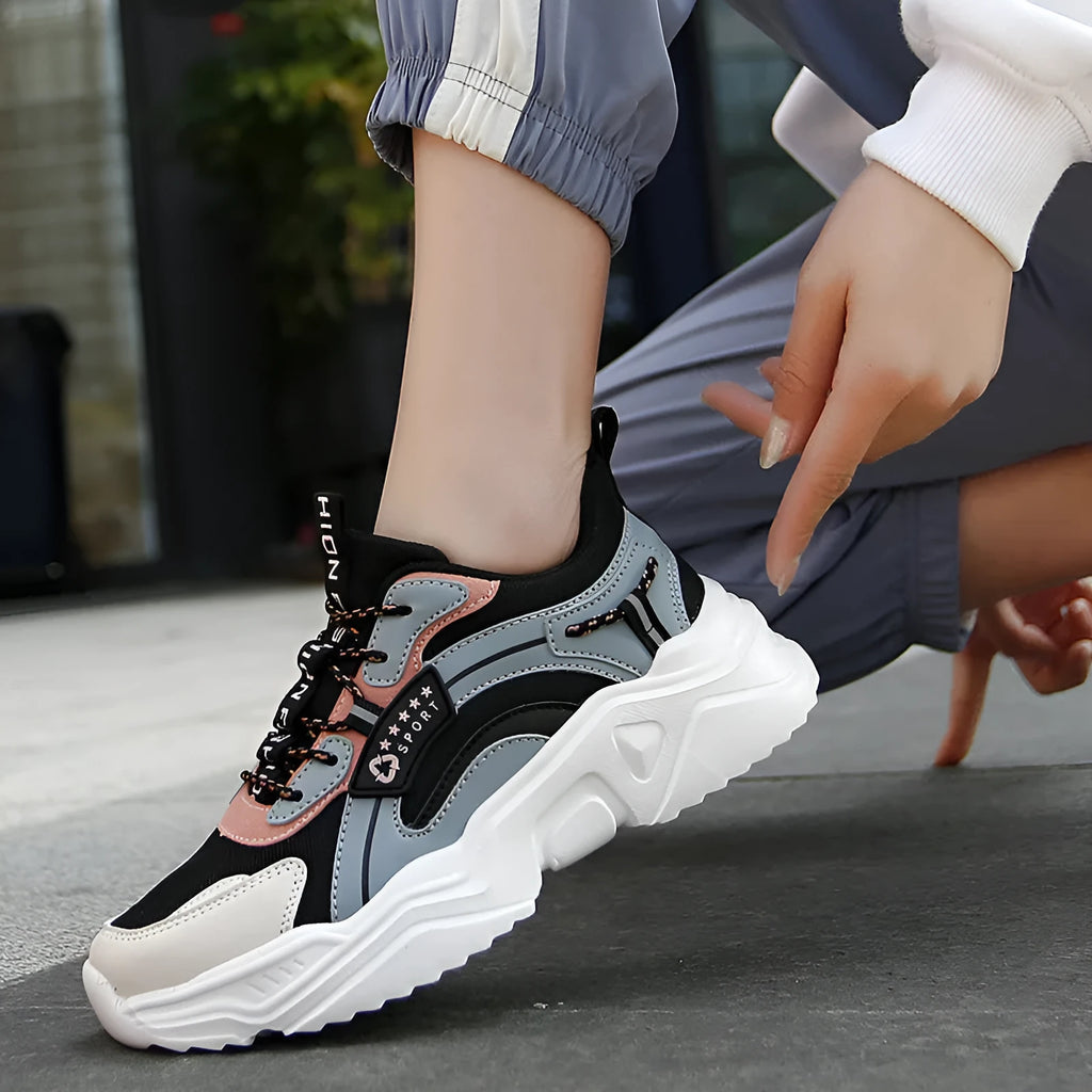 White women's thick-soled casual trainers with mesh upper and buckle detail