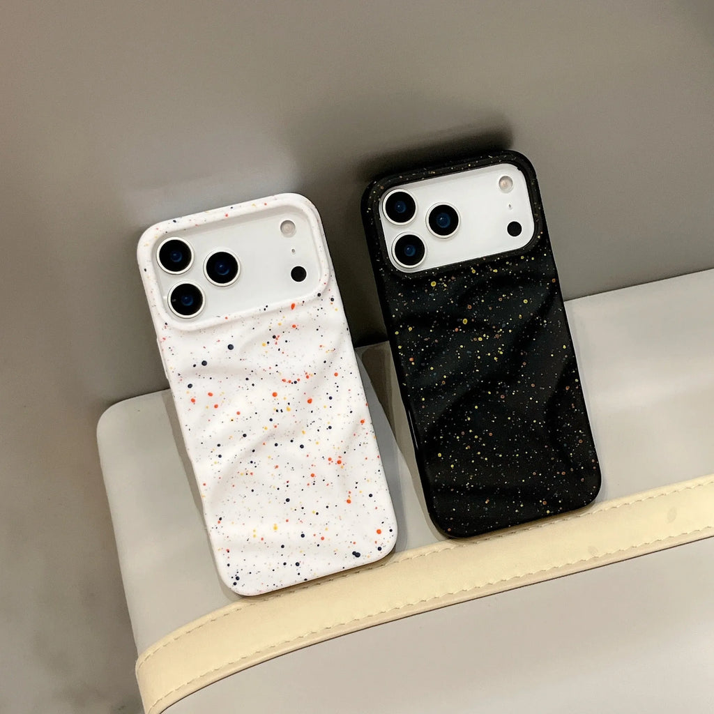 TPU phone case with splash ink pattern in black fitted on an iPhone showing the camera cutout