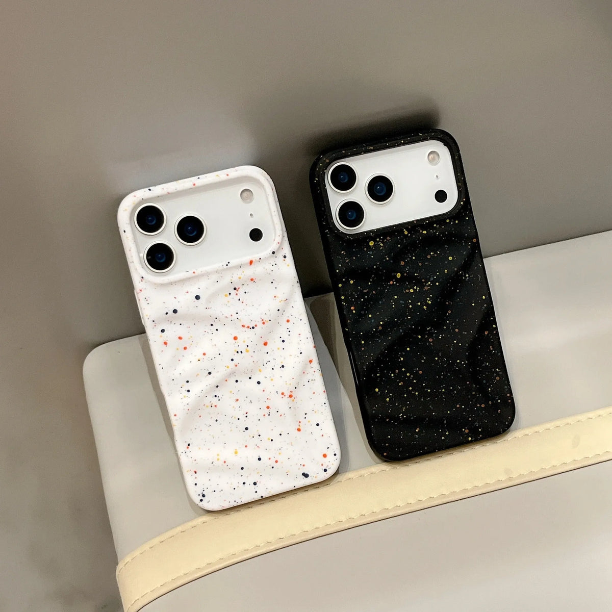 TPU phone case with splash ink pattern in black fitted on an iPhone showing the camera cutout
