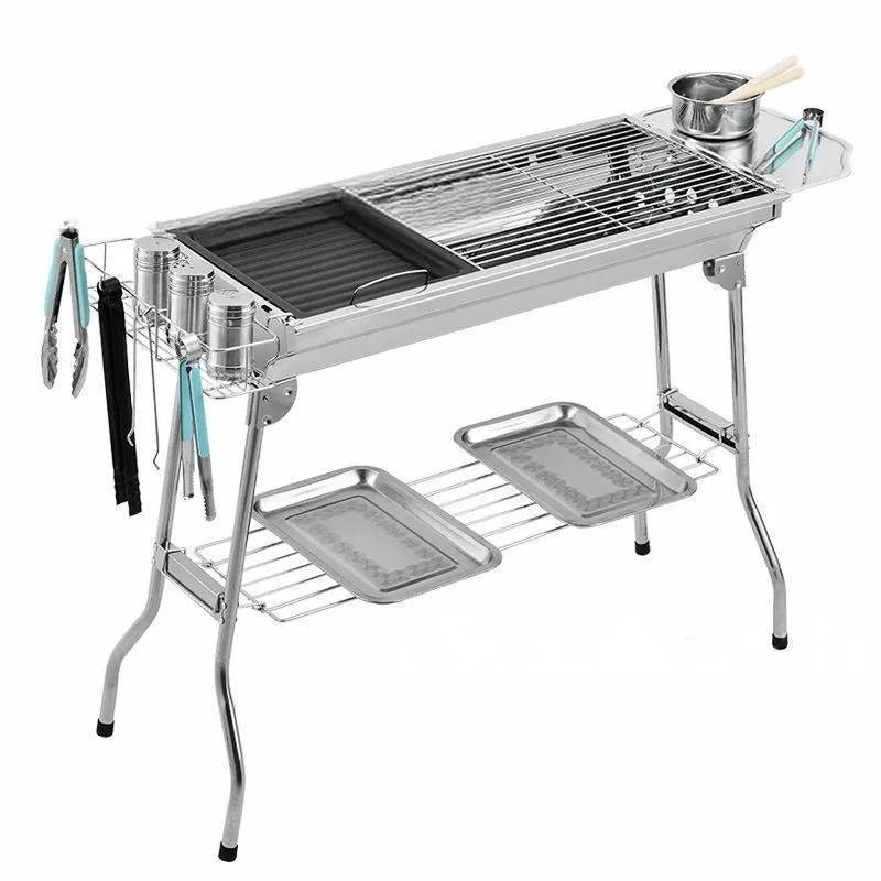 Large stainless steel portable barbecue oven with flip design and multiple grill accessories