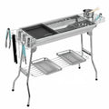 Large stainless steel portable barbecue oven with flip design and multiple grill accessories