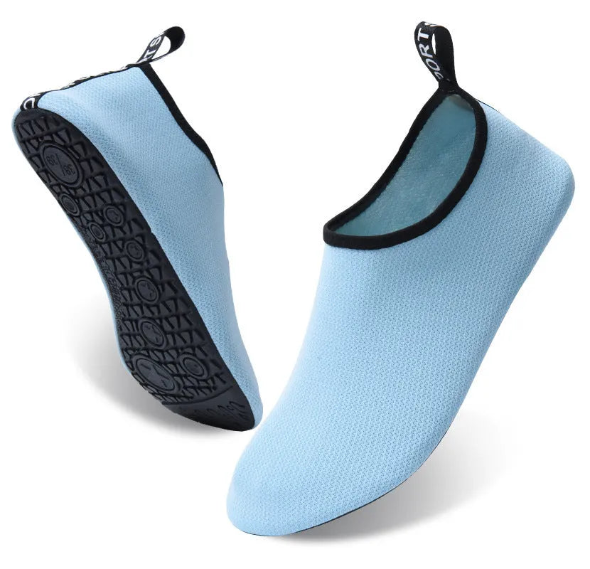Non-slip soft bottom beach shoes with mesh uppers and TPR soles in various colour designs