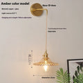 Retro copper Lotus wall lamp with a glass shade in a choice of six colours on a wall.