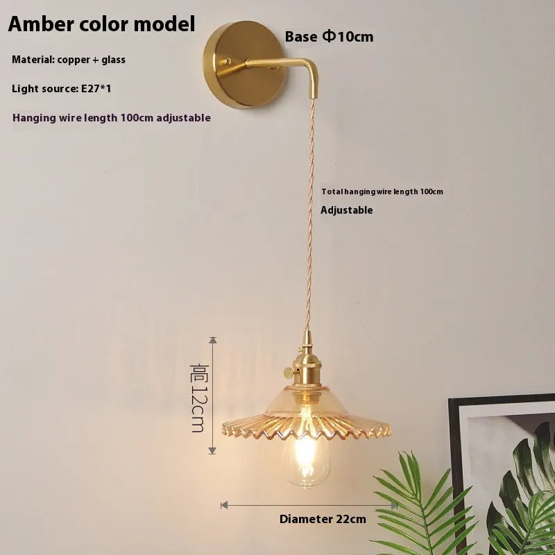 Retro copper Lotus wall lamp with a glass shade in a choice of six colours on a wall.
