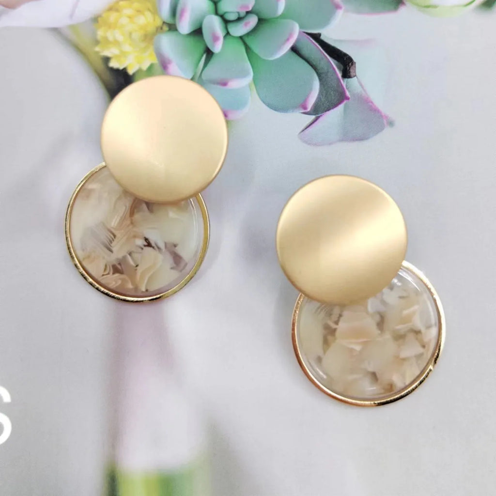 Round matte resin female earrings with retro design and smooth surface for casual wear.
