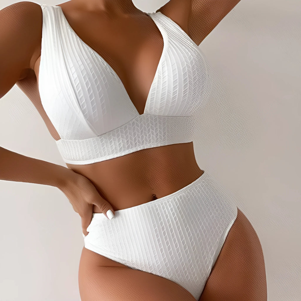 White backless women's bikini swimsuit on a mannequin
