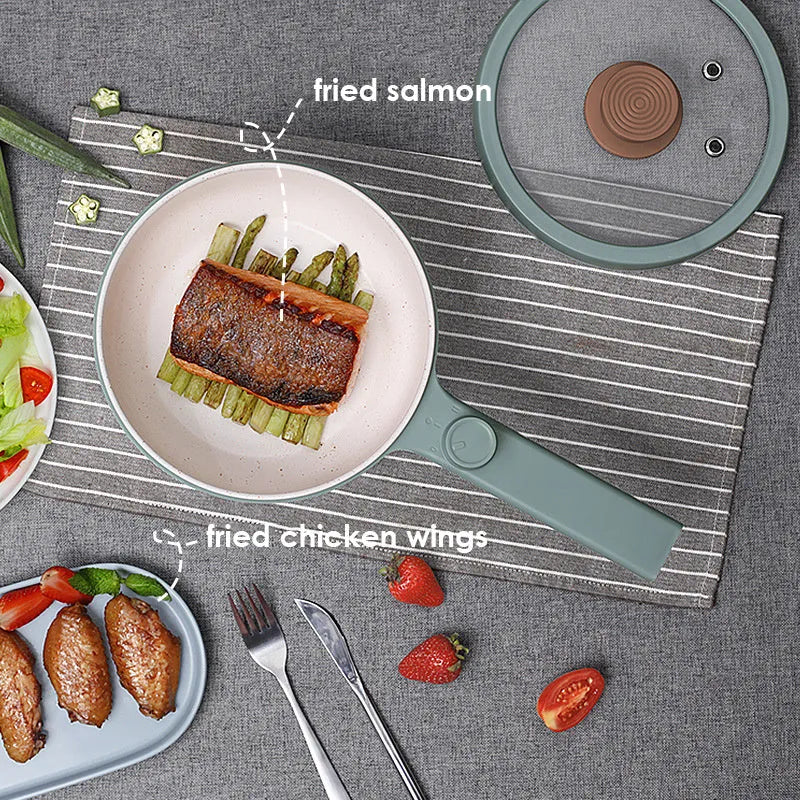 White and green multi-function electric cooking pot with control panel, 600W power, and compact design.