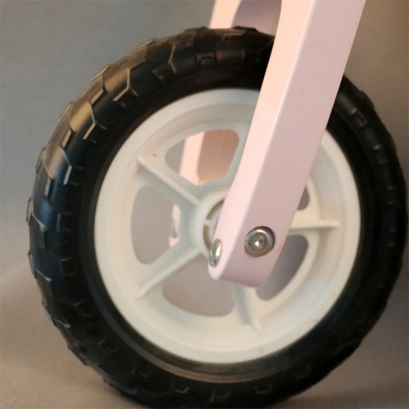 Pink wooden toddler balance scooter with 10-inch deck for children aged 1-6 years.