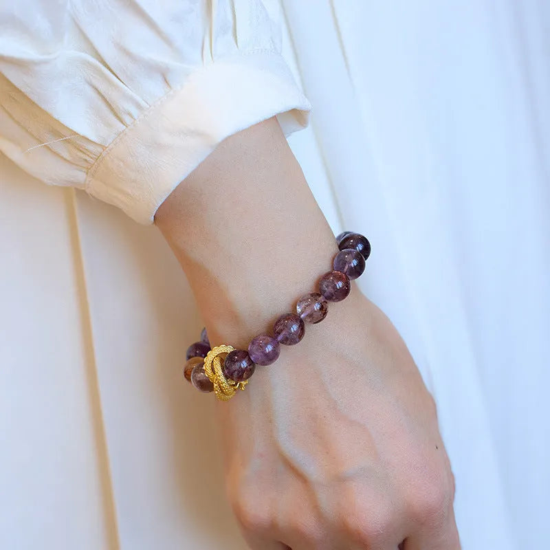 Purple ghost stone nine purple good luck crystal bracelet with 10mm beads and animal zodiac design.