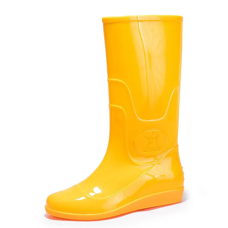 White and yellow plastic washable rain boots with high-tube design and flat heels for labour protection