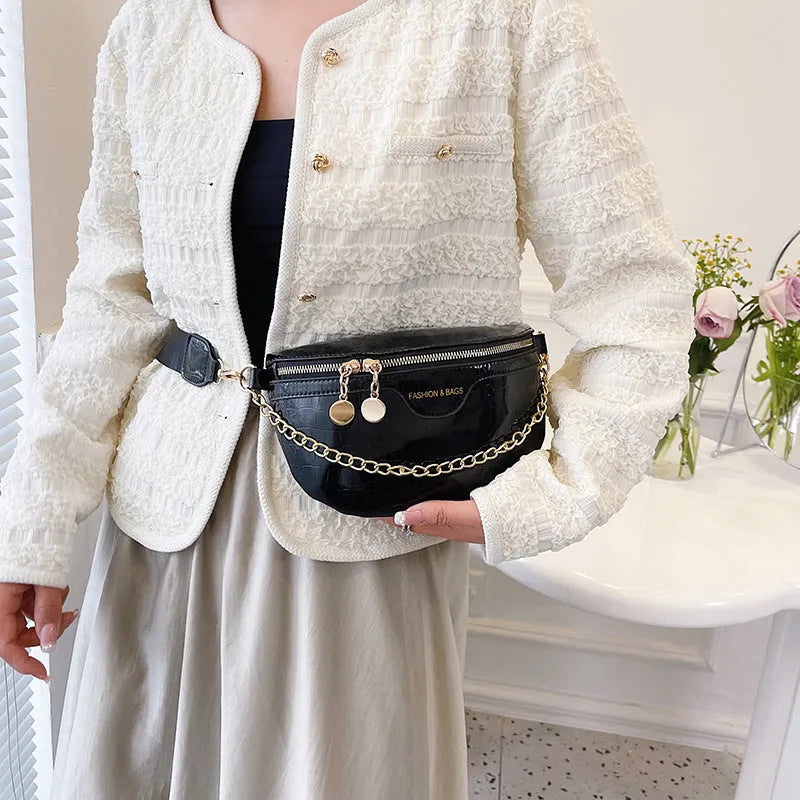 Shiny PU leather chest bag with WesternWide shoulder strap and chain detail, available in multiple colours