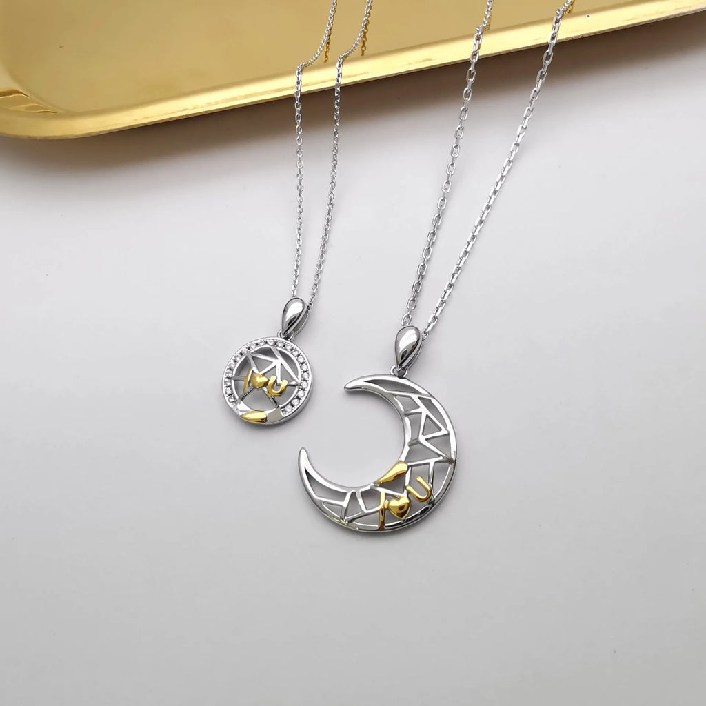 Sun moon tooth couple necklace with copper pendant on a cross chain, showing male and female colour variants.
