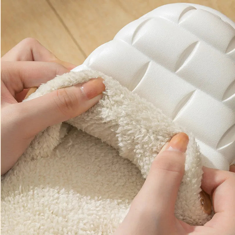 Plaid detachable slippers for women with plush lining and EVA sole in pink, shown on a wooden floor.
