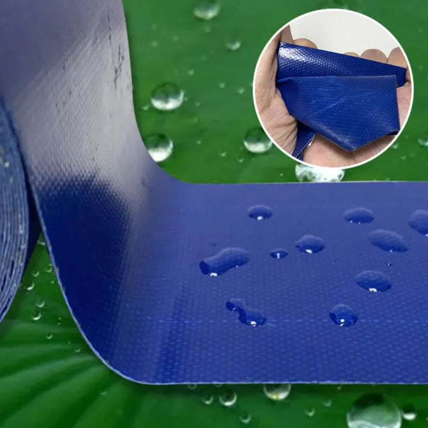 Roll of blue truck rainproof cloth repair tape 8cm wide 5m long on grey surface