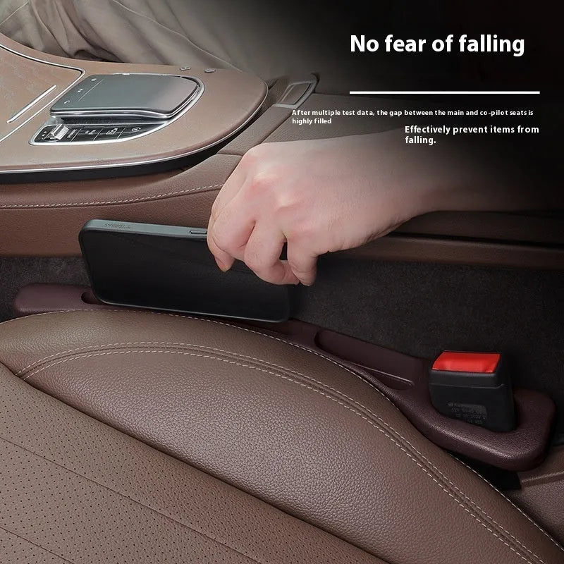 Leak-proof car seat gap filler strip in black installed between driver seat and centre console