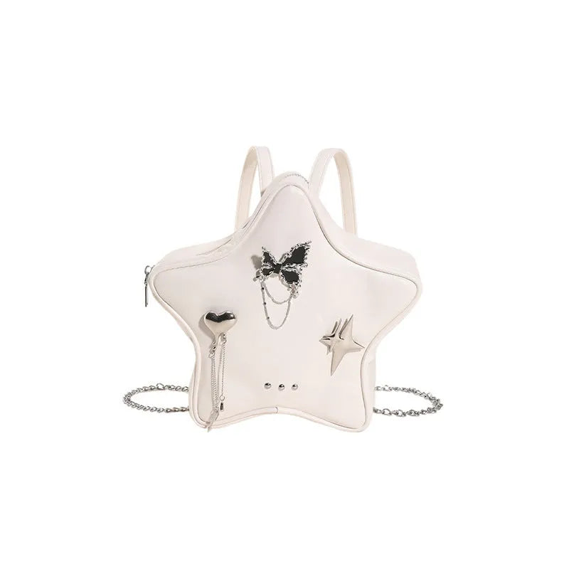Women's soft black PU leather mini messenger backpack worn crossbody.