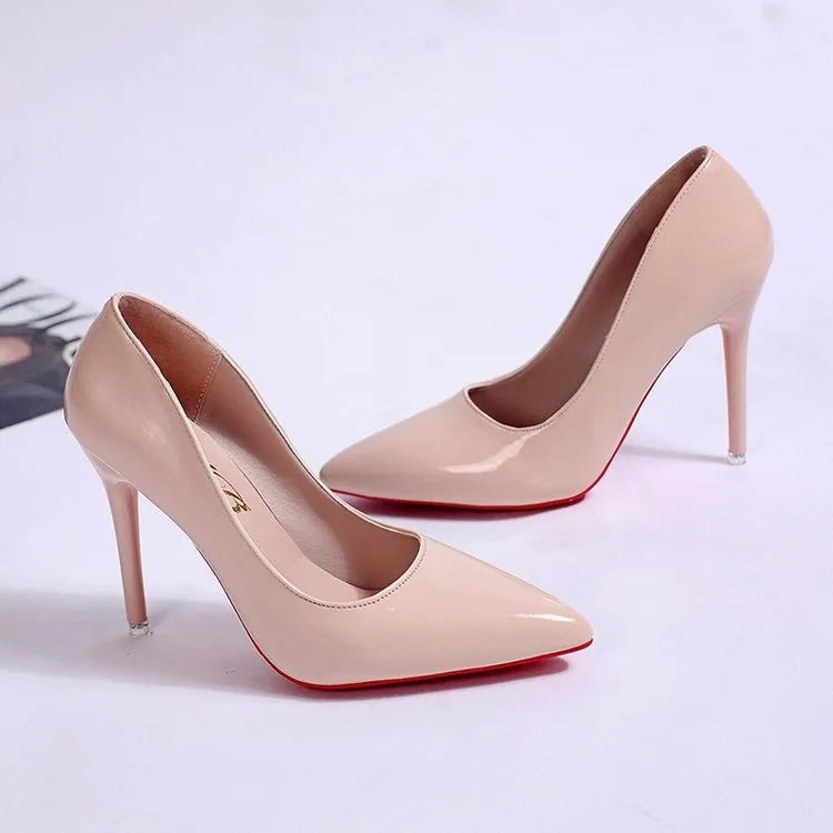 Women's black stiletto heel pump with pointed toe and shallow mouth opening on a white background.