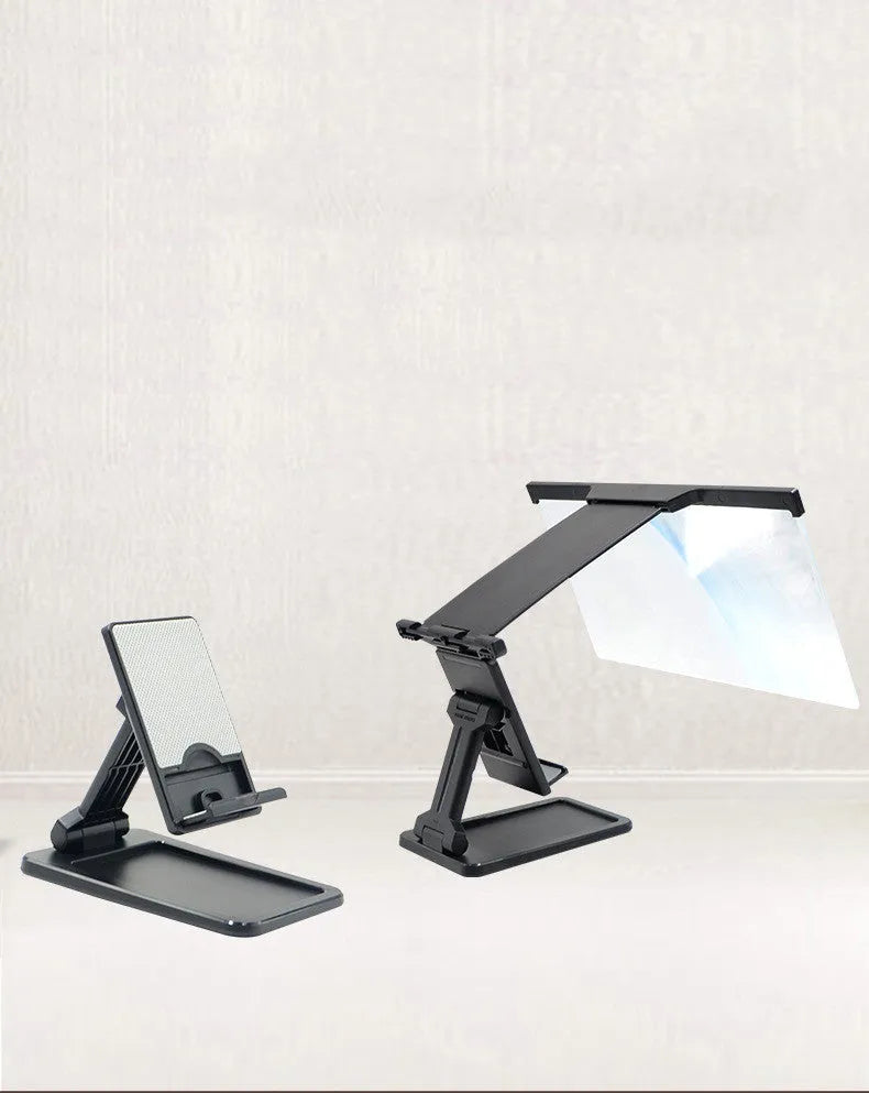 Black foldable mobile phone screen amplifier with detachable holder on a desk