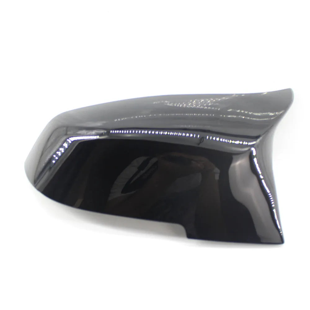 Pair of paint bright black BMW F-Series rear-view mirror replacement shells.