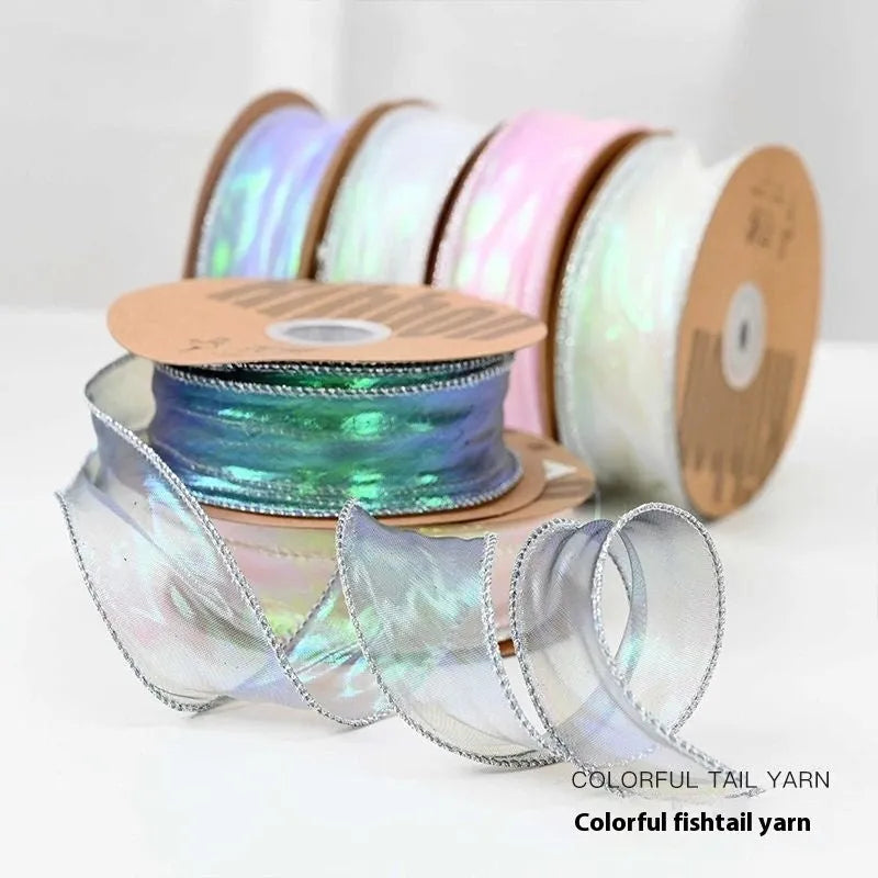 Roll of colourful fishtail yarn mesh decorative ribbon showing wave texture and multiple colour options