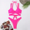 Women's solid colour strap bikini swimsuit in briefs style on a mannequin.