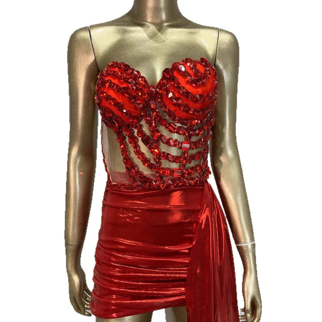 Red female skirt suit with hollow mesh see-through panels, a stage and party costume made from spandex.