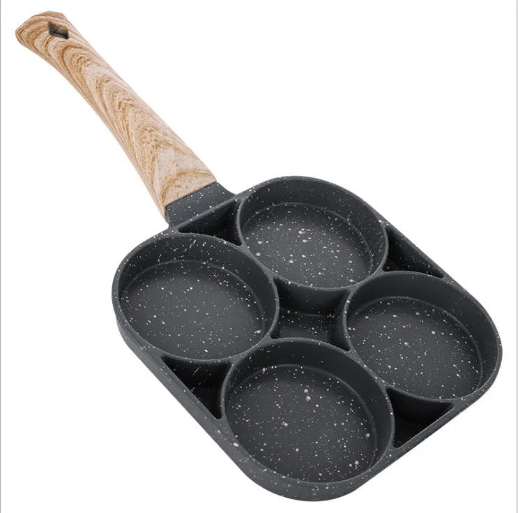 Non-stick egg dumpling frying pan in black aluminium with two holes for cooking breakfast burgers