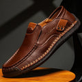 Men's leather casual shoes in black with round toe, shallow opening, and rubber sole
