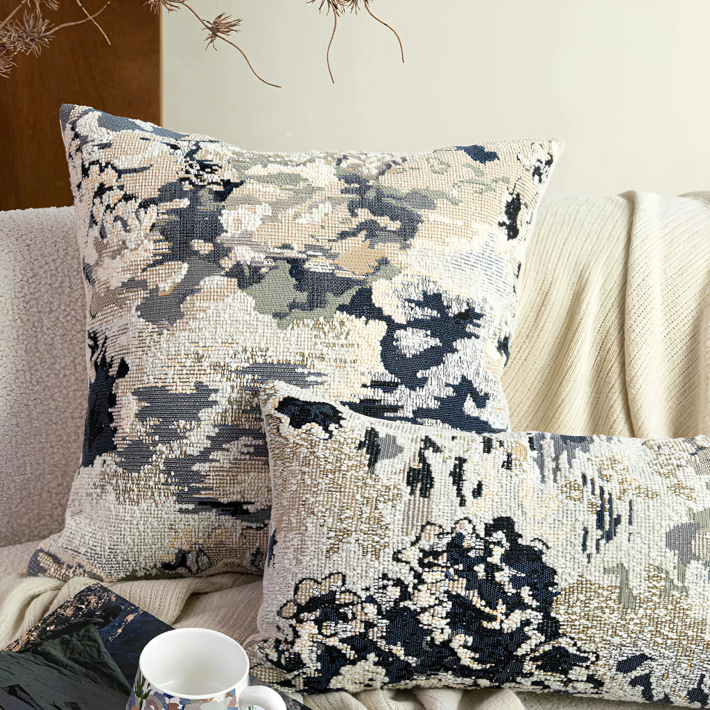Antique blue wool-blended square throw pillow with abstract floral pattern on a neutral sofa