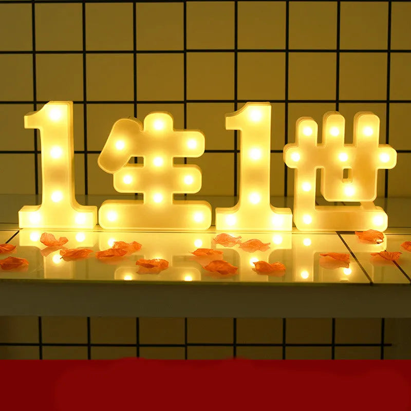 Plastic LED letter light decoration spelling a message, 22cm in height.