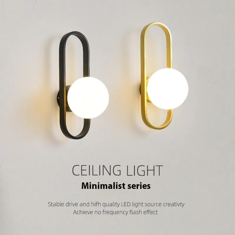 Minimalist glass wall lamp with iron body in black finish mounted beside bed