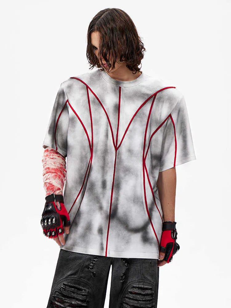 Women's short sleeve T-shirt with padded shoulders and raised line patchwork design in a round neck style.