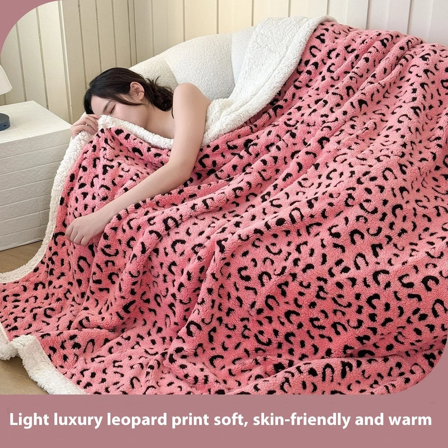 Double-layer taffeta blanket with woven leopard print pattern draped over sofa