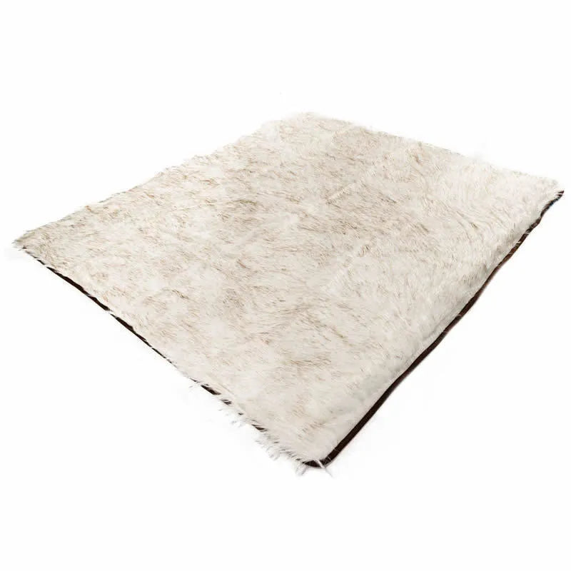 White with brown accents machine washable waterproof dog couch bed on a floor