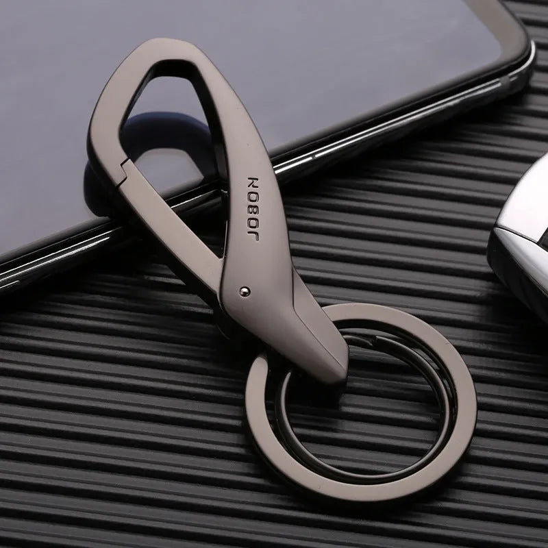Black zinc alloy double ring car keychain attached to a belt loop.