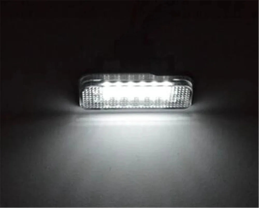 Mercedes Benz LED licence plate light unit showing white PC housing and 18 LED beads.
