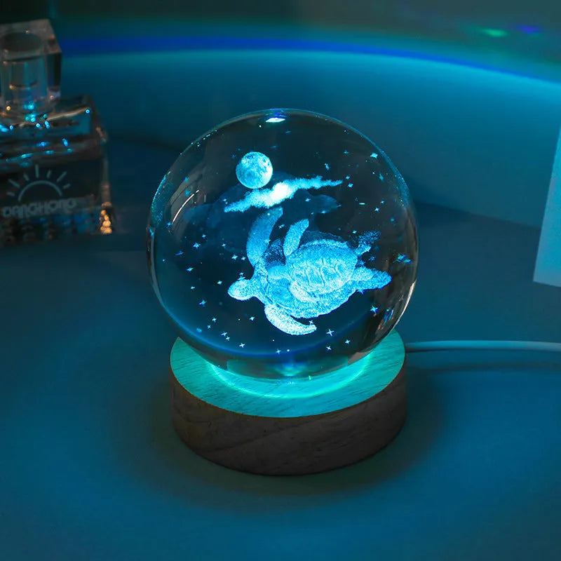 Colorful luminous crystal ball on light wooden base with data cable