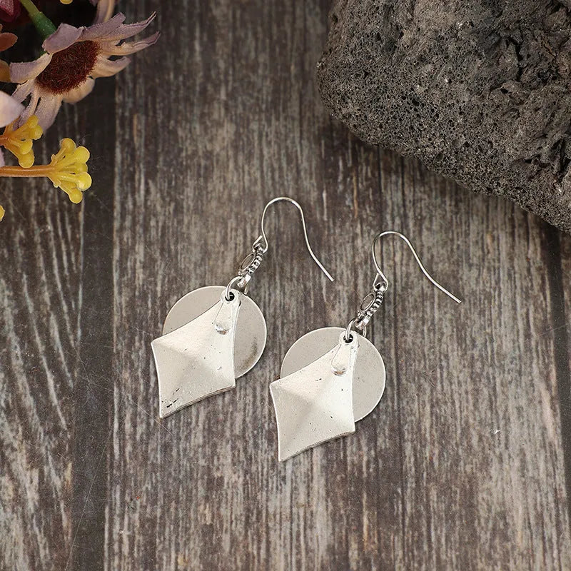 Silver geometric alloy earrings with layered retro design and round shape
