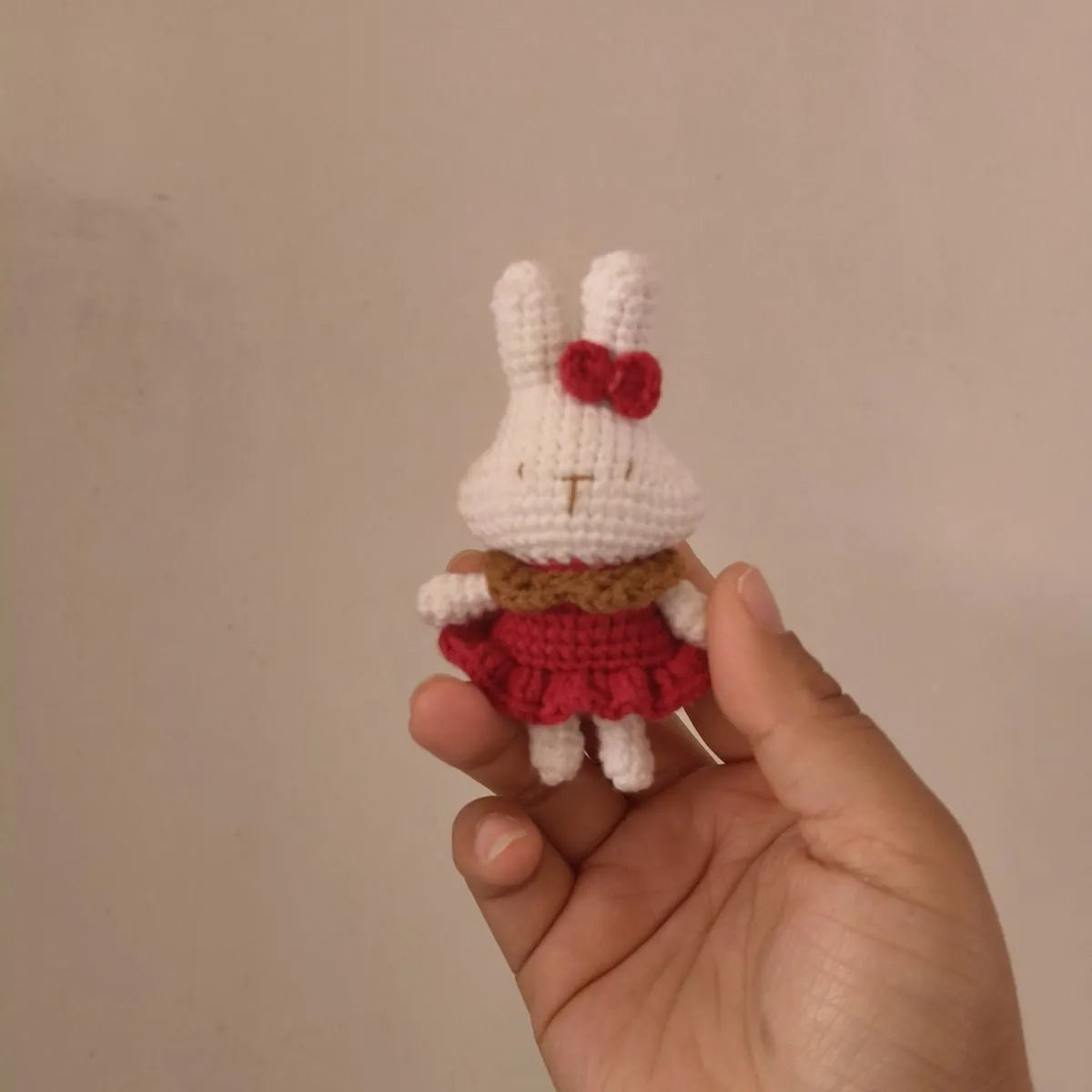 Hand-crocheted wool rabbit key chain pendant in amigurumi style